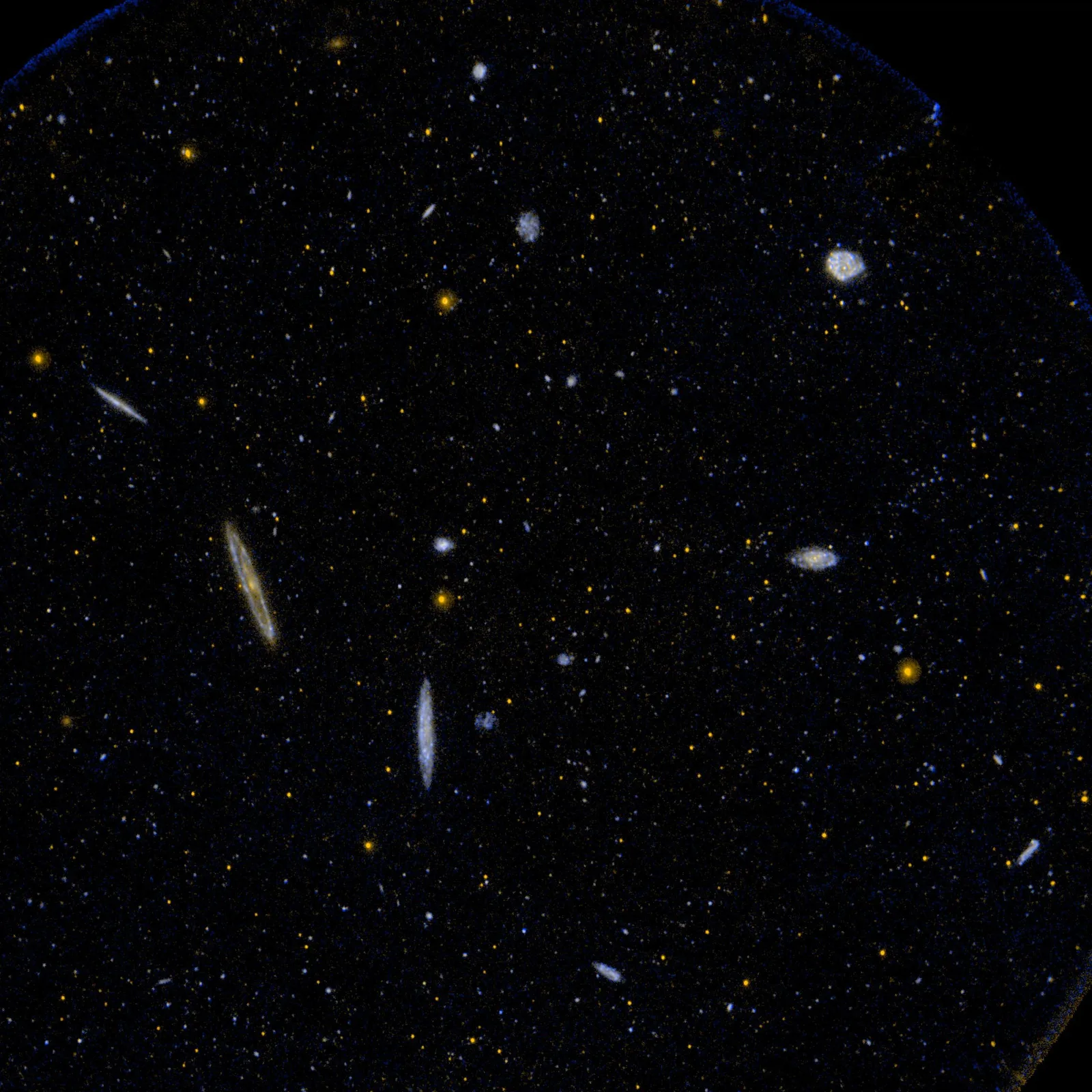 A rich cluster of elliptical and spiral galaxies glowing against the dark plane of the Milky Way, representing the obscured Norma Cluster at the heart of the Great Attractor.