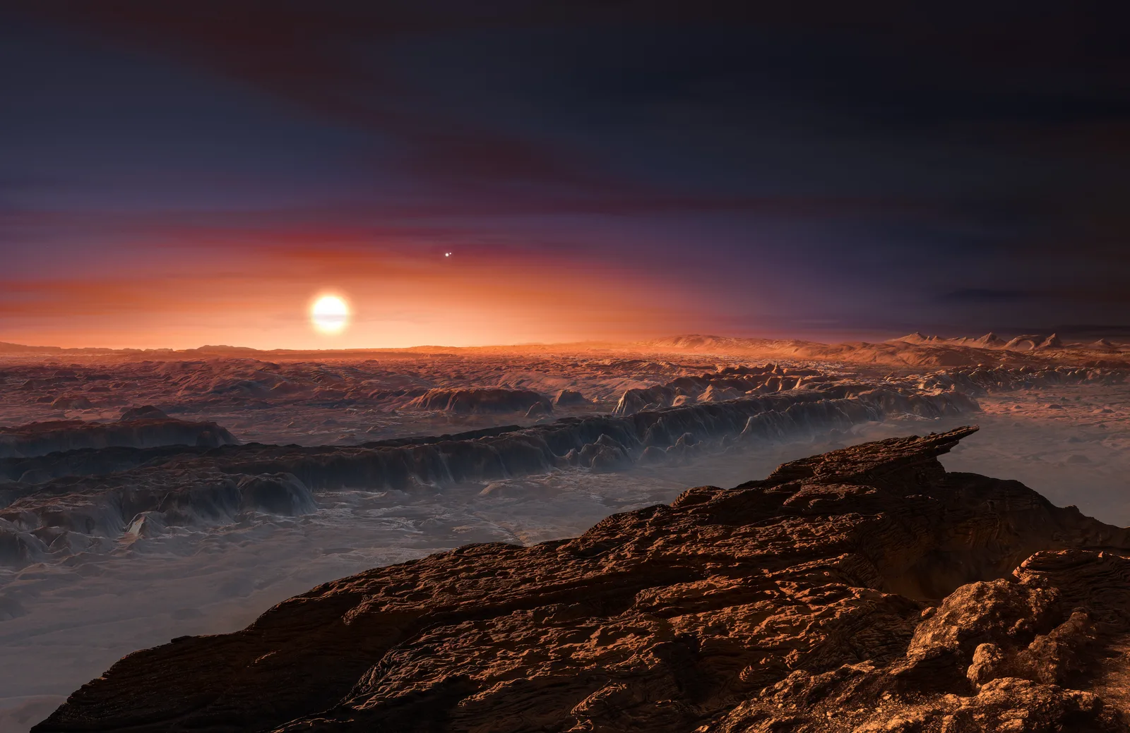 Artist's impression of the rocky surface of Proxima Centauri b with the dim red disk of its host star low on the horizon.