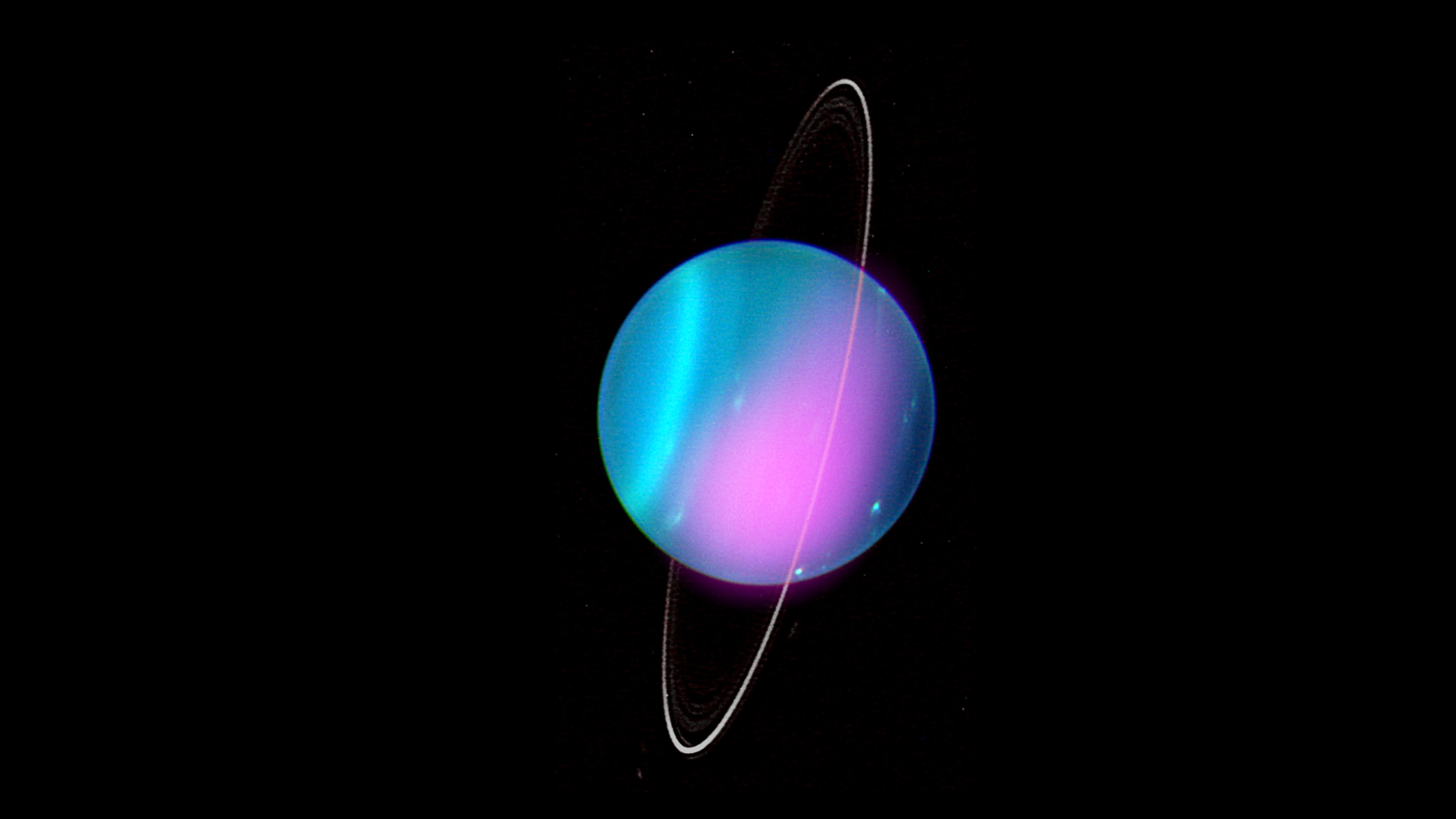 Voyager 2 image of Uranus showing its featureless blue-green disk